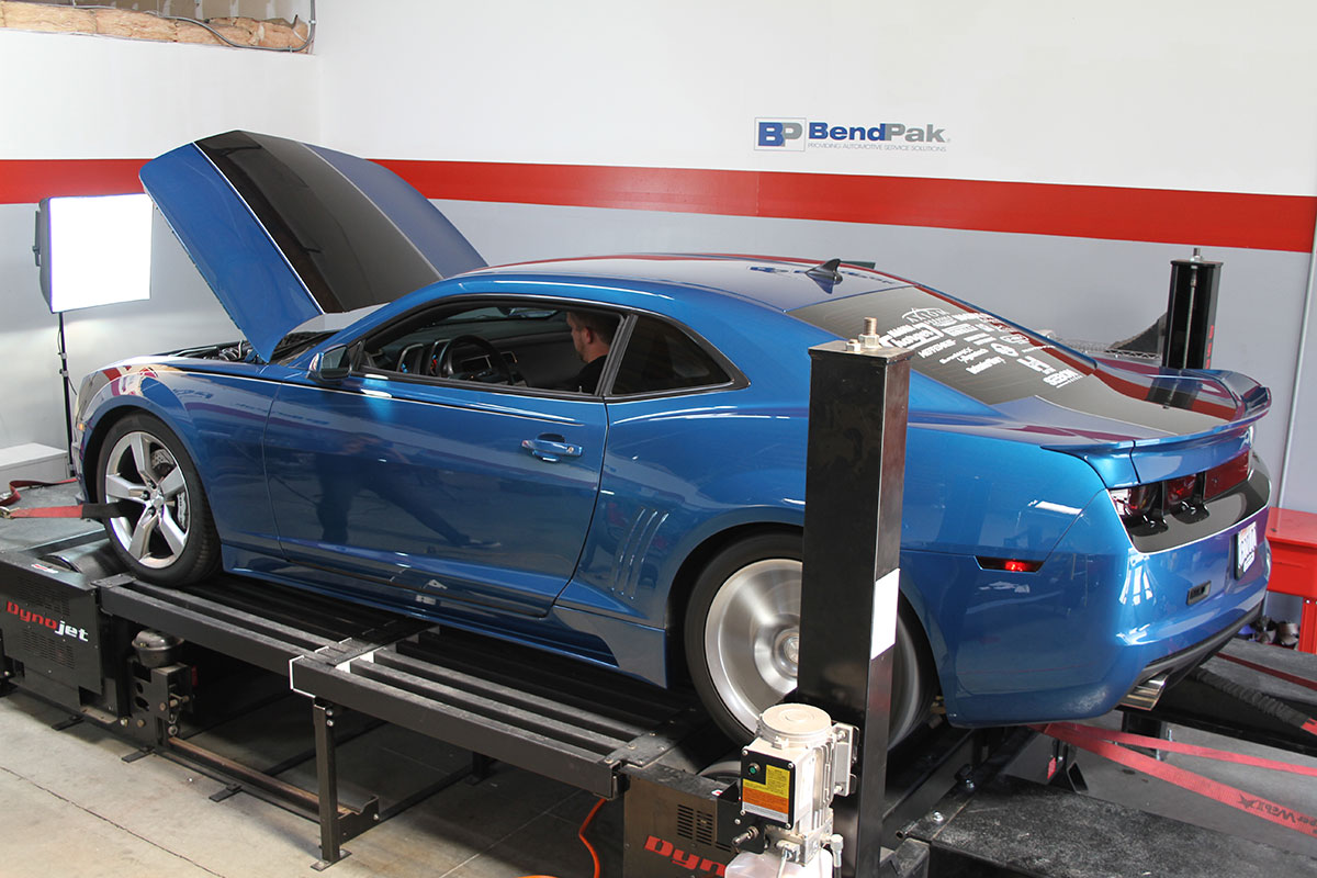 blue camaro on a rolling dyno